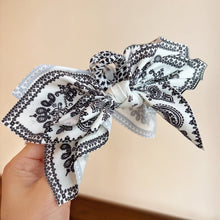 Load image into Gallery viewer, Double-Sided Paisley Bow Hair Claw